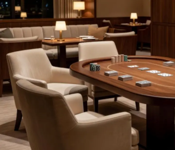 Card lounge at ADSIGHT LTD with poker tables and warm evening lighting